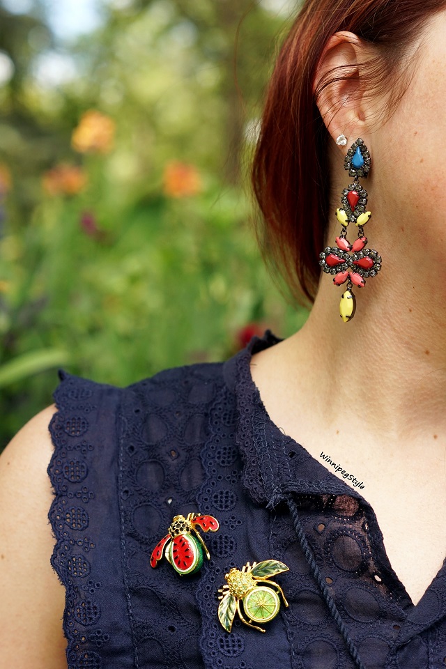 Canadian Fashion Blog, stylist, Chicwish navy blue eyelet lace peplum top, The Shopping Channel Joan River fruit watermelon lime bee pins brooch, BCBG Max Azria drop colored stone earrings, St. Vital park Flower gardens, Summer 2018